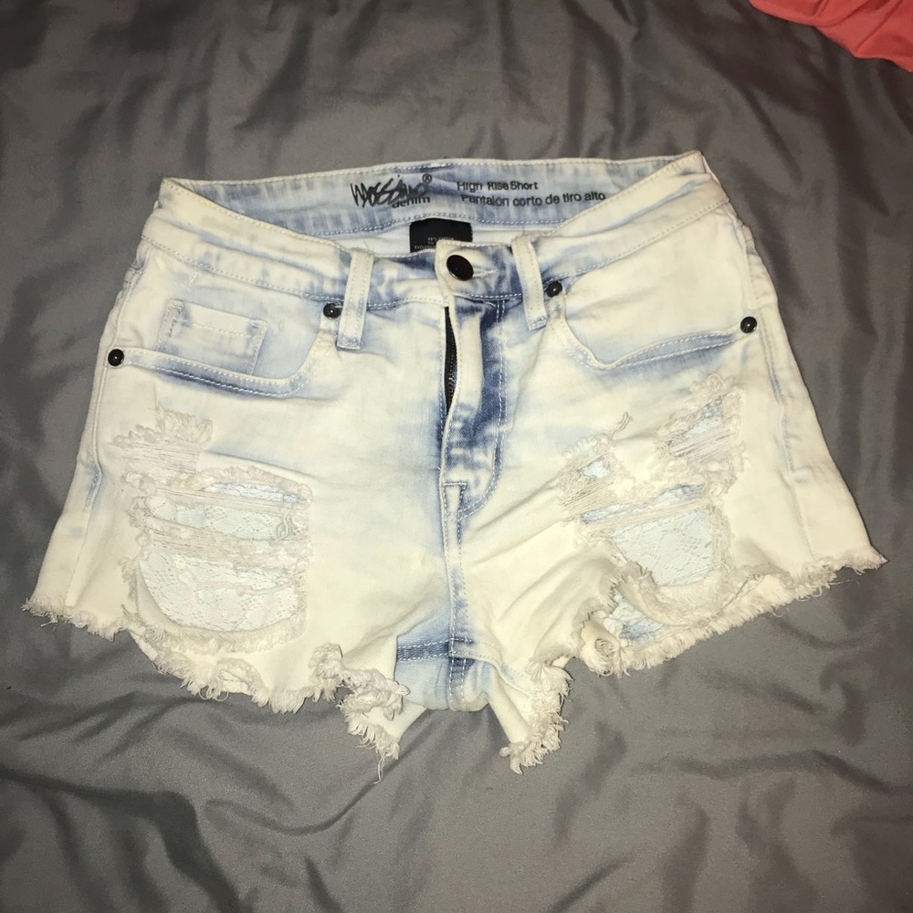 Ripped acid wash jeans with lace pockets