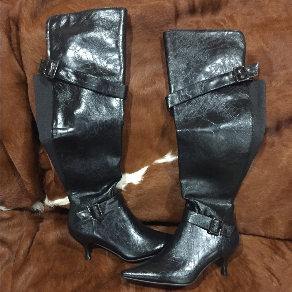 Knee high black heeled boots