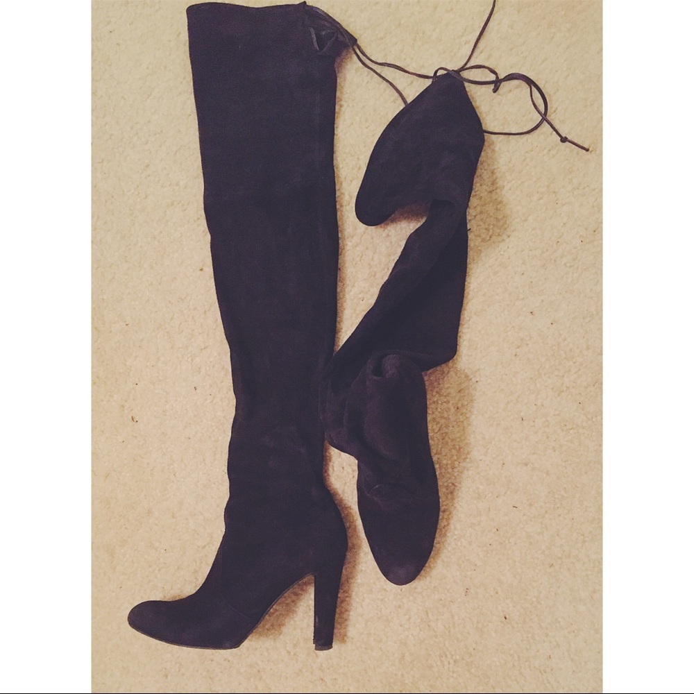 Covering your thighs with the trendy Stuart boots!