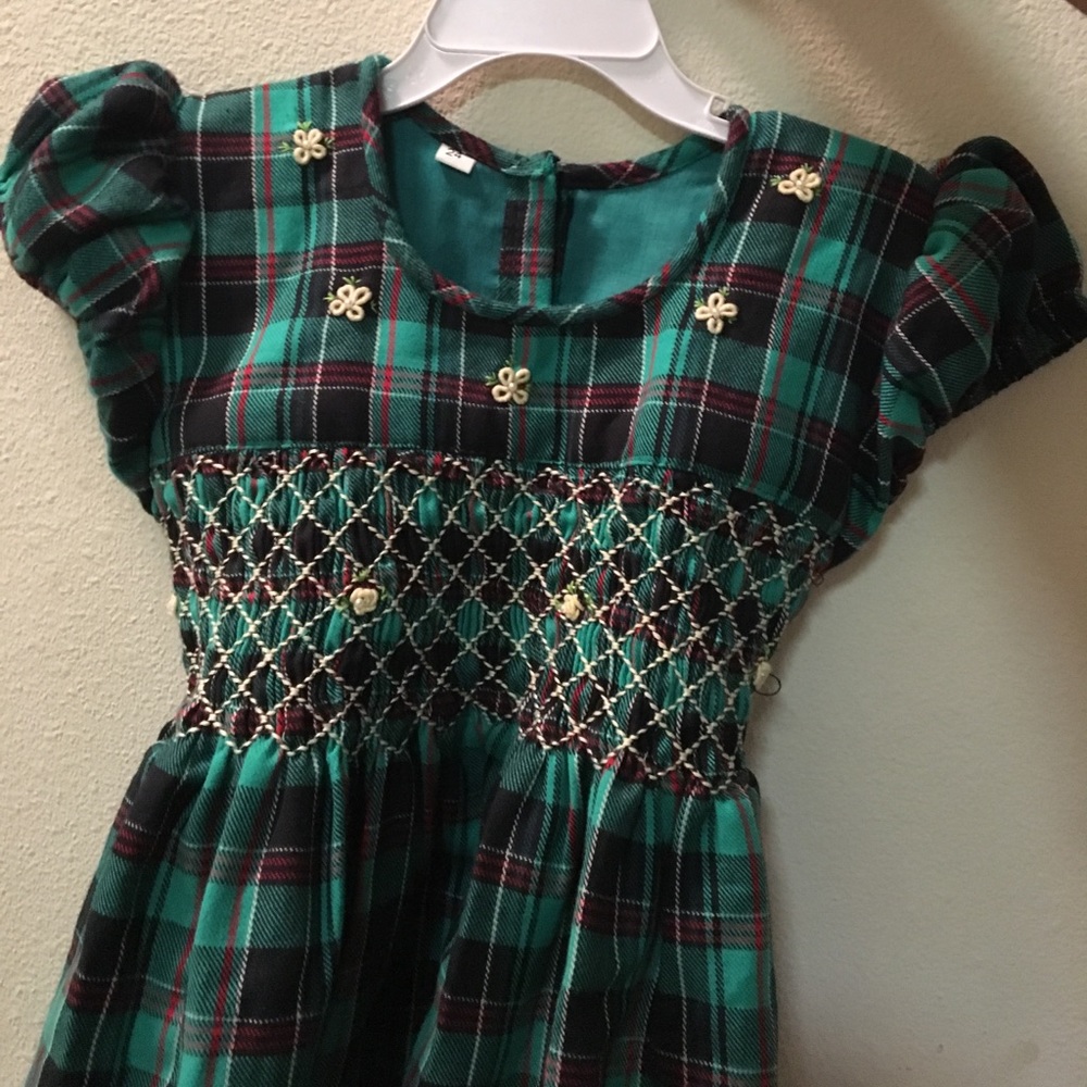 Adorable dress with smocking & embroidery detail!