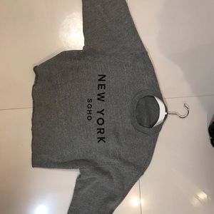 Cropped grey sweat shirt with writing