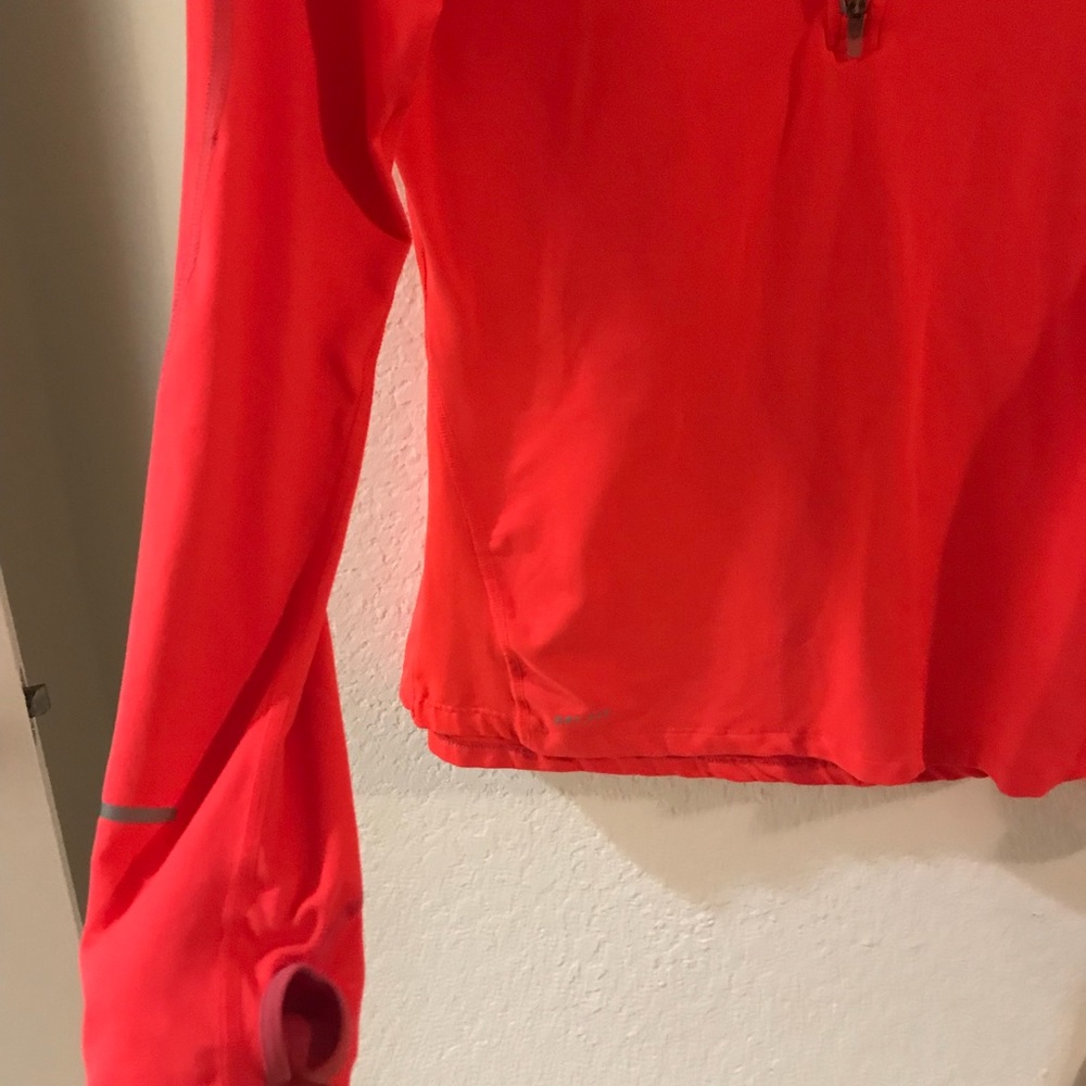Salmon colored Nike jacket