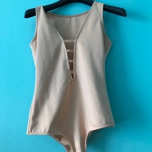 Peach leotard cut out front