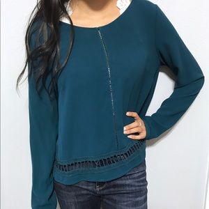 Teal blouse with detailed cutouts