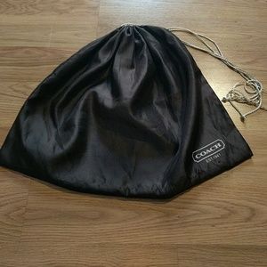 Large authentic Coach silky dust bag.