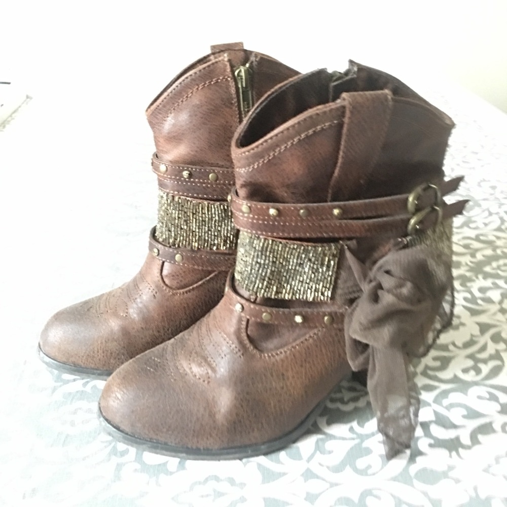 Brown beaded heel booties.