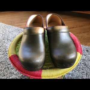 Dansko dark green clogs.