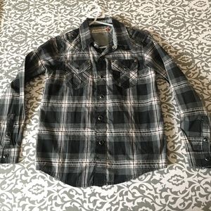 Boys black plaid snap shirt.