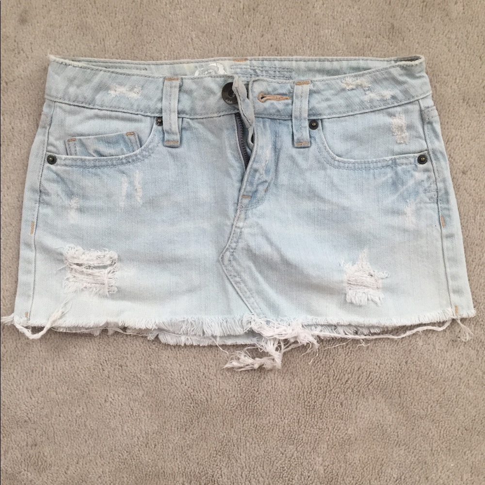 Distressed light blue denim mini skirt