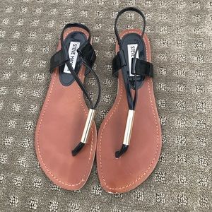 Steve Madden black and gold sandals.