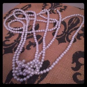 Light blue faux pearl necklace.