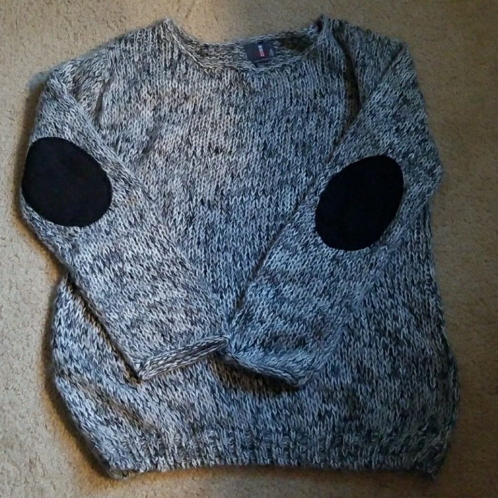 Sweater with elbow patches.