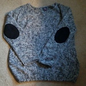 Sweater with elbow patches.
