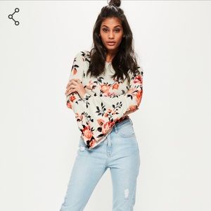 Floral long sleeve bodysuit. Flared sleeves.