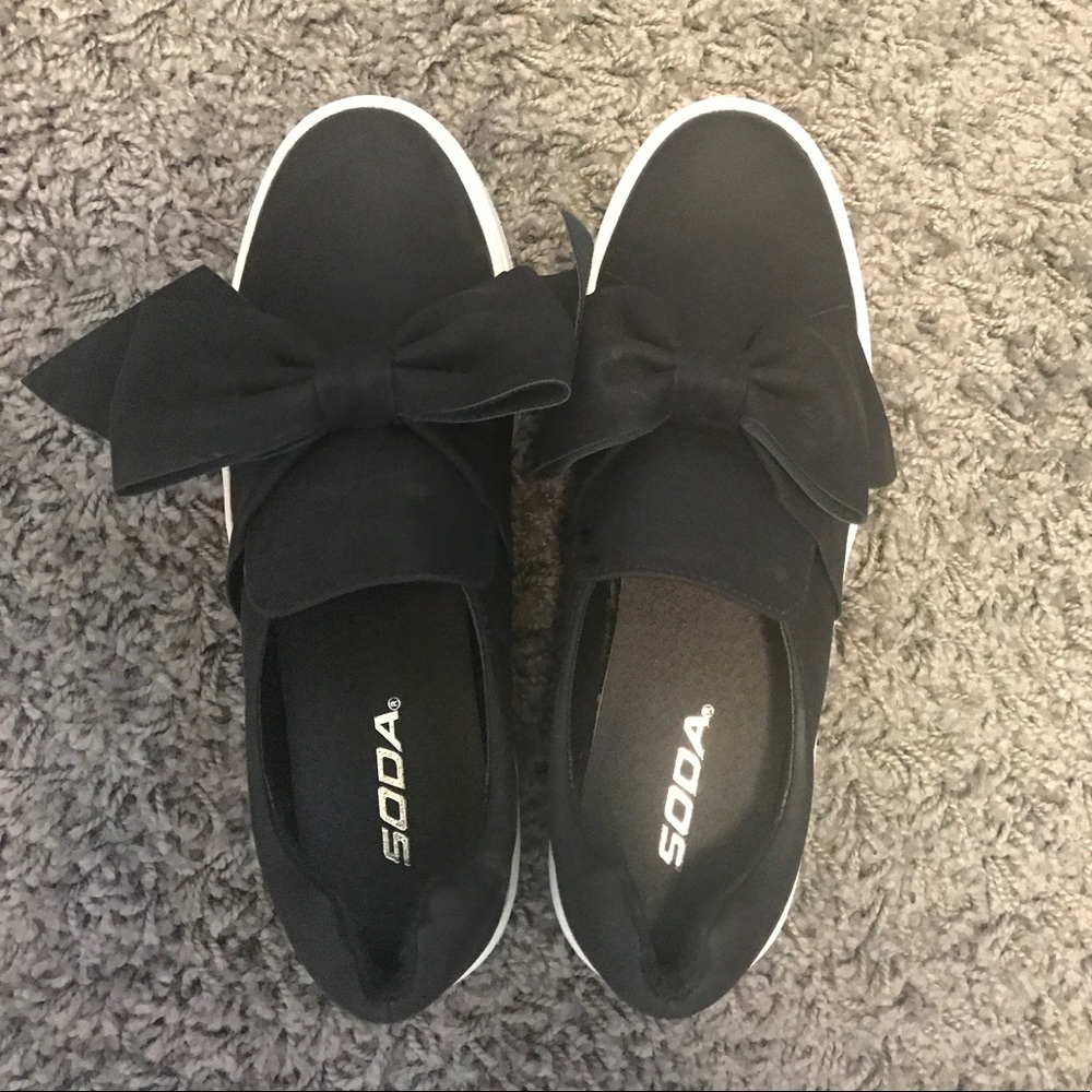 Black platform tennis shoes with bow