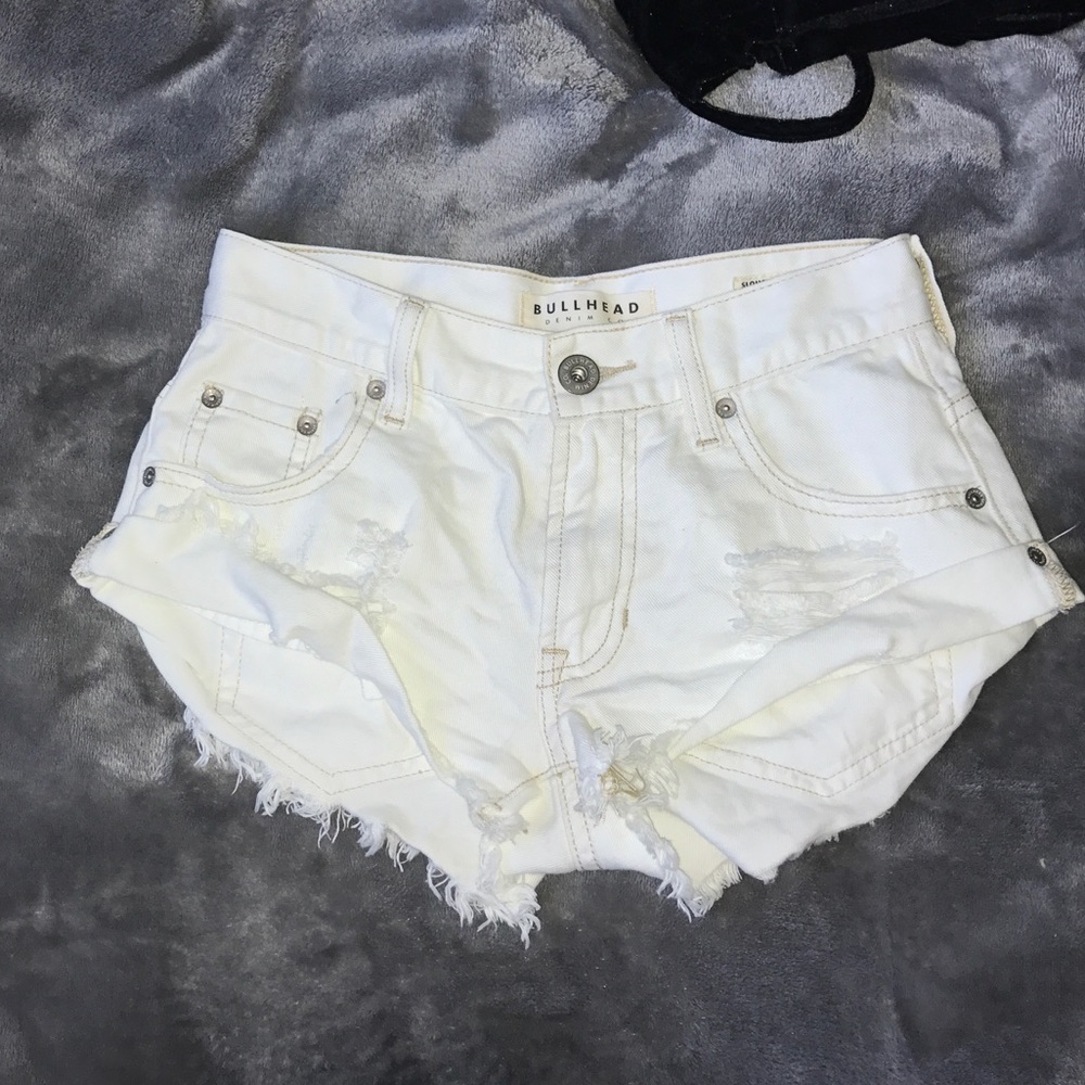 White destressed shorts