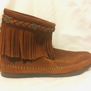 Brown suede boots with fringe around the top
