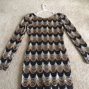 Black and gold sequin dress