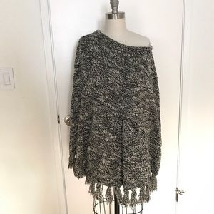 Sweater Poncho with fringes.