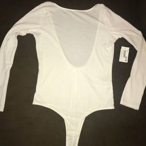 Never worn ivory colored body-suit