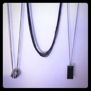 Bundled long silver and black necklaces