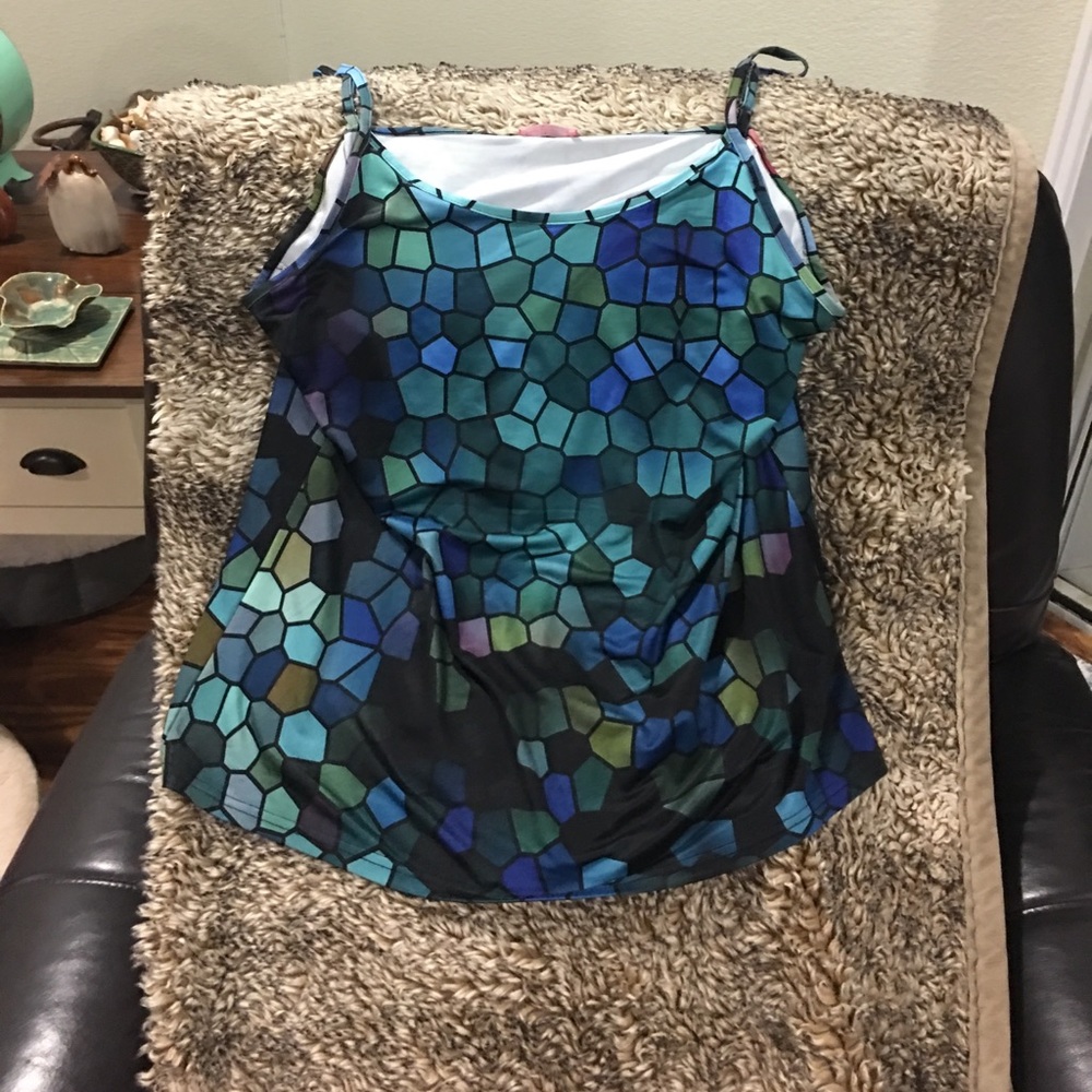 Camisole never worn. Adjustable straps.