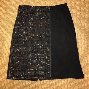 Black and gold tweed skirt with leather trim