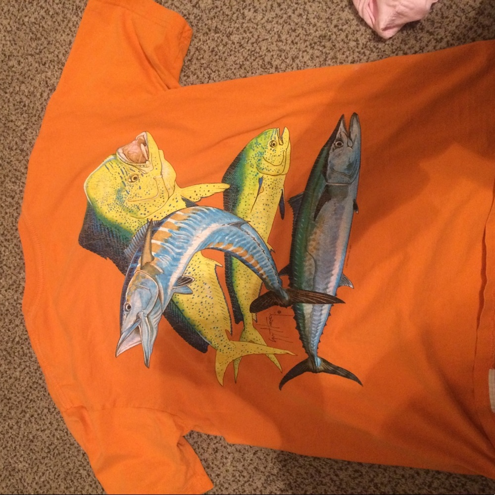 A couple year old bright orange Guy Harvey tee