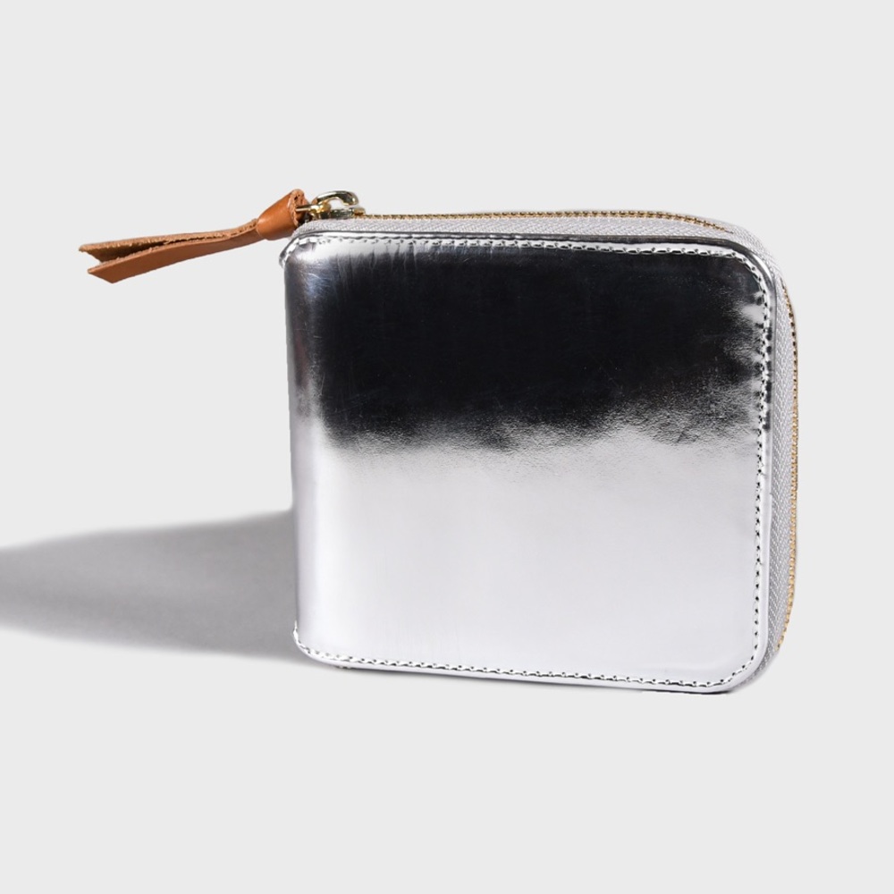 Clare V silver mirror Waller with pink lining.