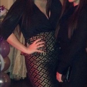 Women's black and gold plus size dress.