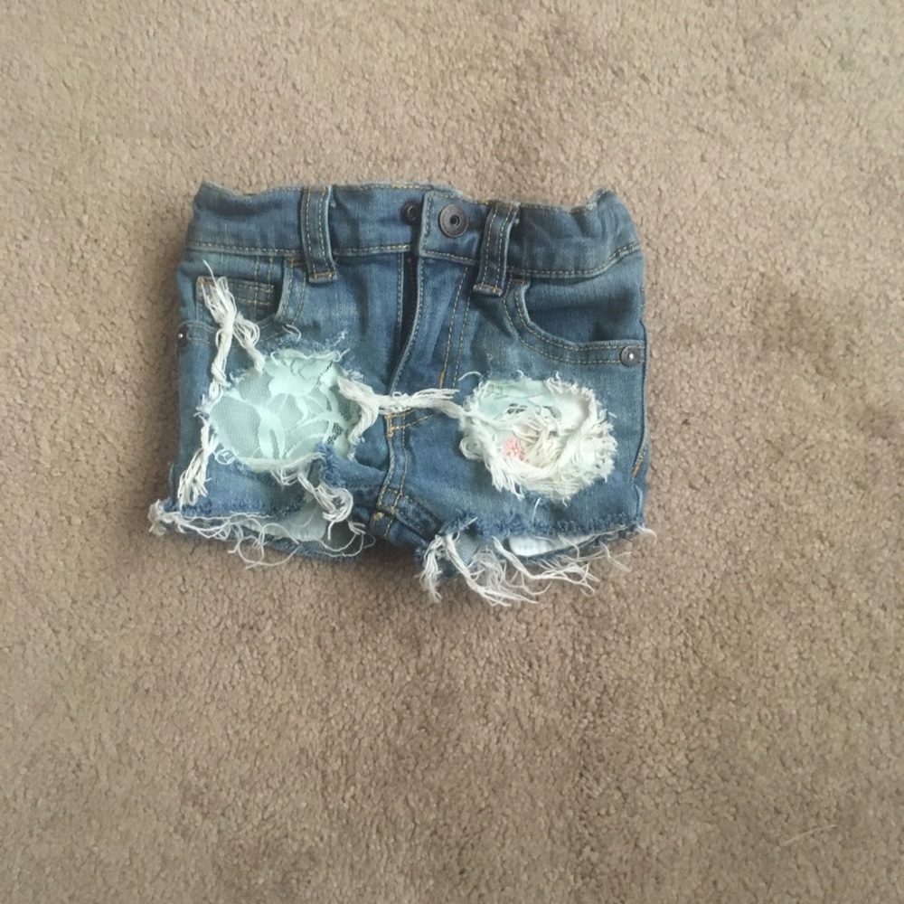 Handmade floral and lace distressed denim.