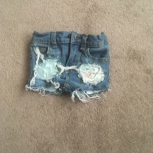 Handmade floral and lace distressed denim.