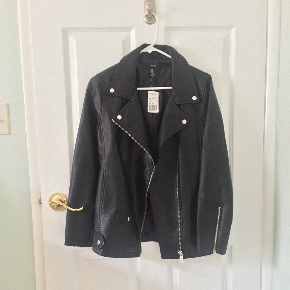Faux leather jacket w/ zipper detail.