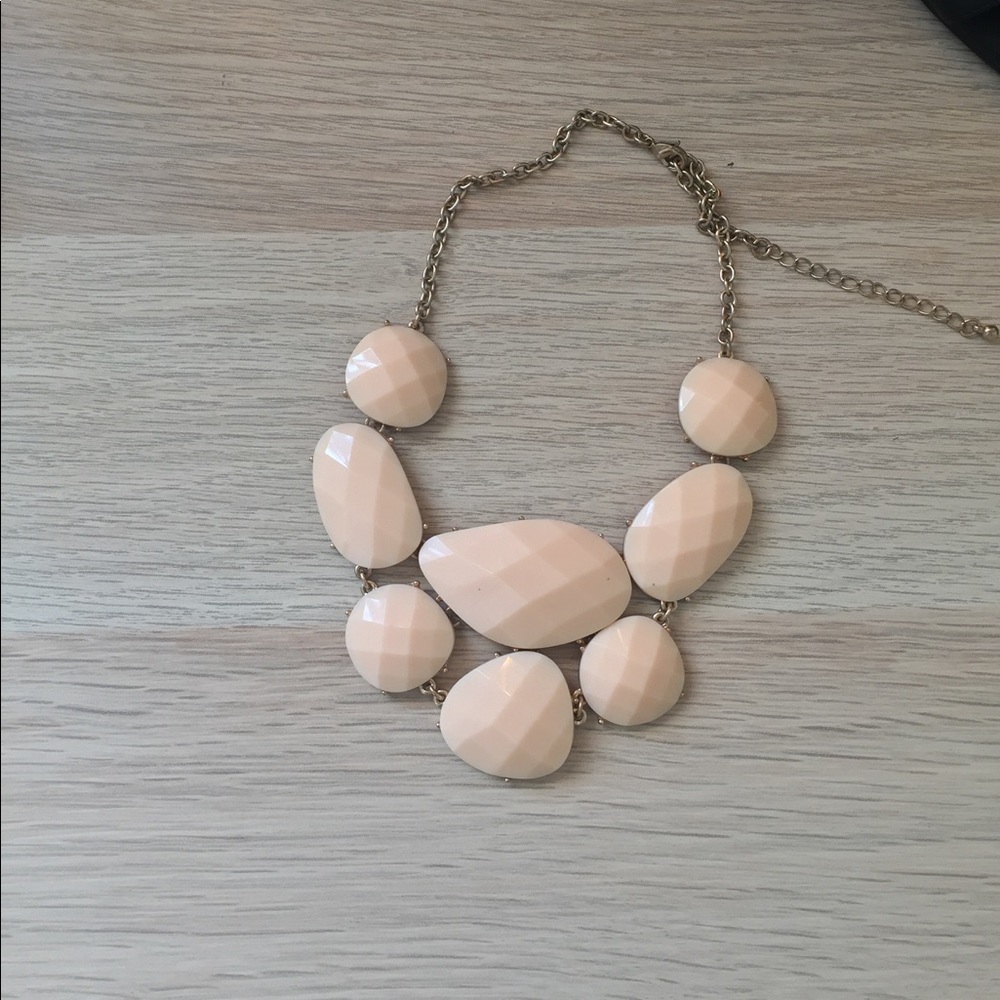Cream colored stone necklace.