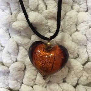 Glass cognac heart. ❤️On a black leather cord.