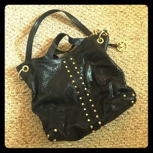 Michael Kors black and gold studded hobo bag