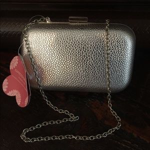 Silver cross body clutch