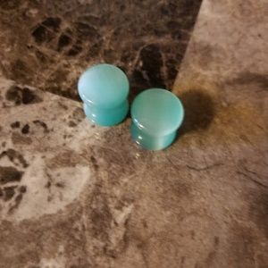 Teal cats eye plugs
