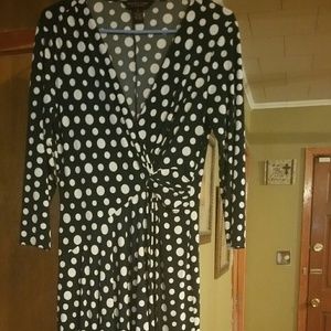 A navy and white polka dots dress by Robbie Bee