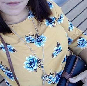 Mustard floral blouse and purple cardigan