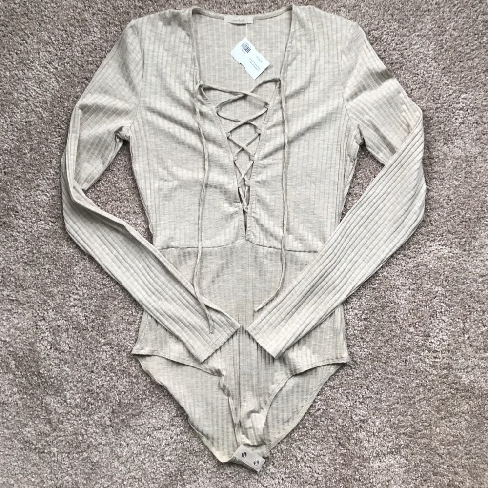 NWT. Cream, ribbed, lace up bodysuit. Size S.
