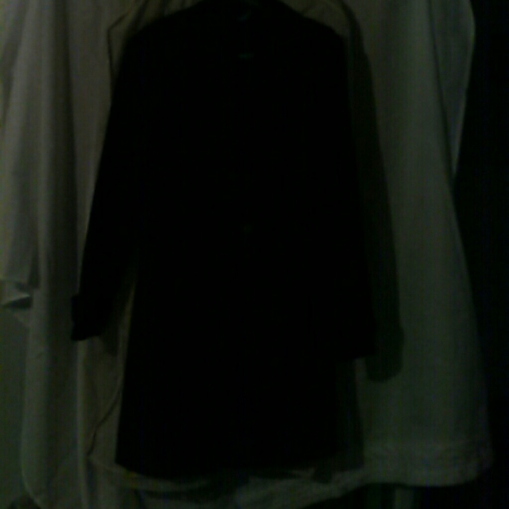 Hold for Katoa, black coat