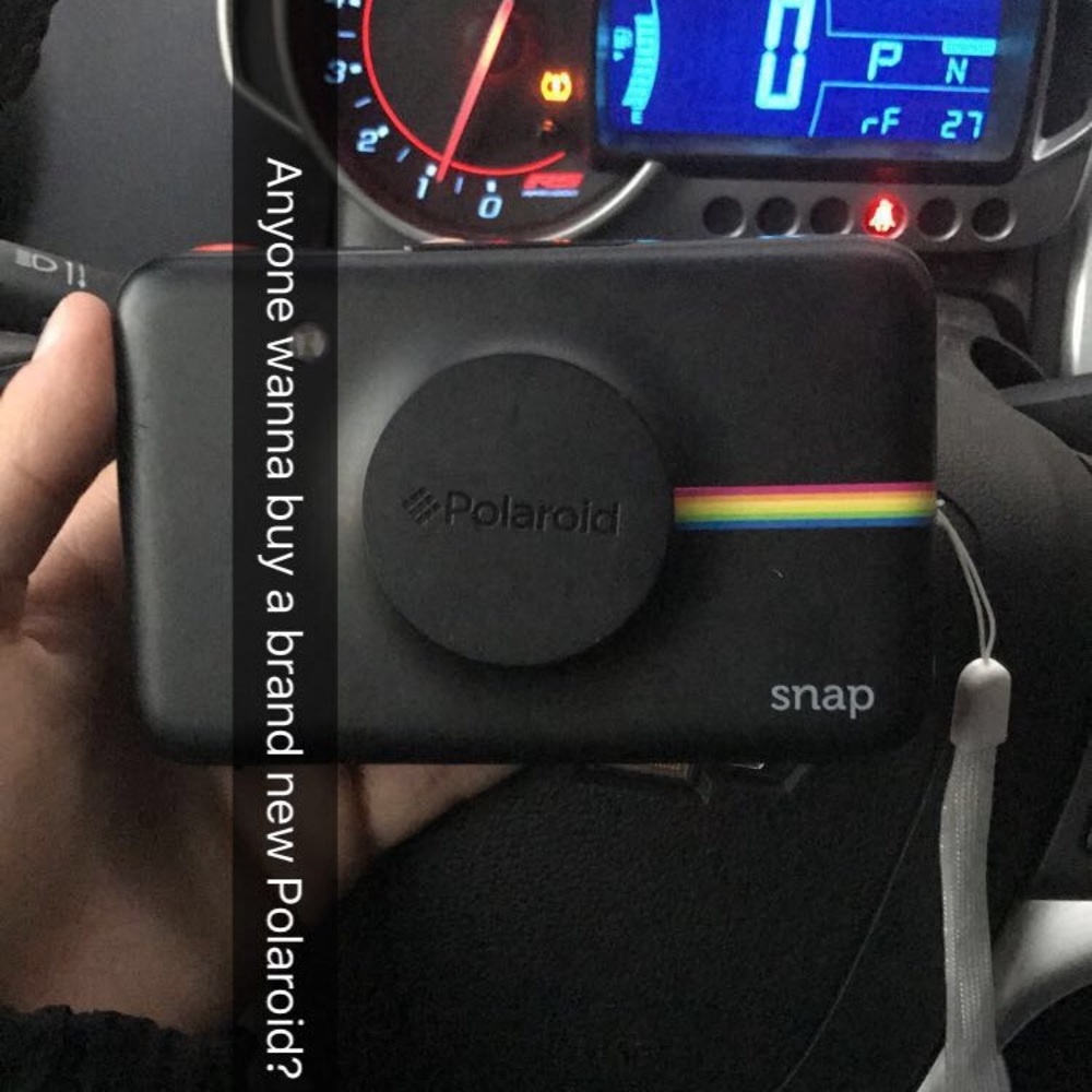 Brand new Polaroid camera with camera paper.