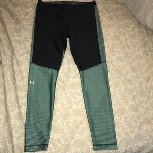 black, green, and blue under armour leggings