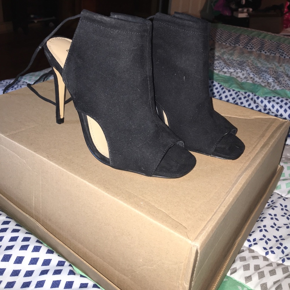 A pair of black heels