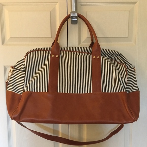 white luggage with leather trim