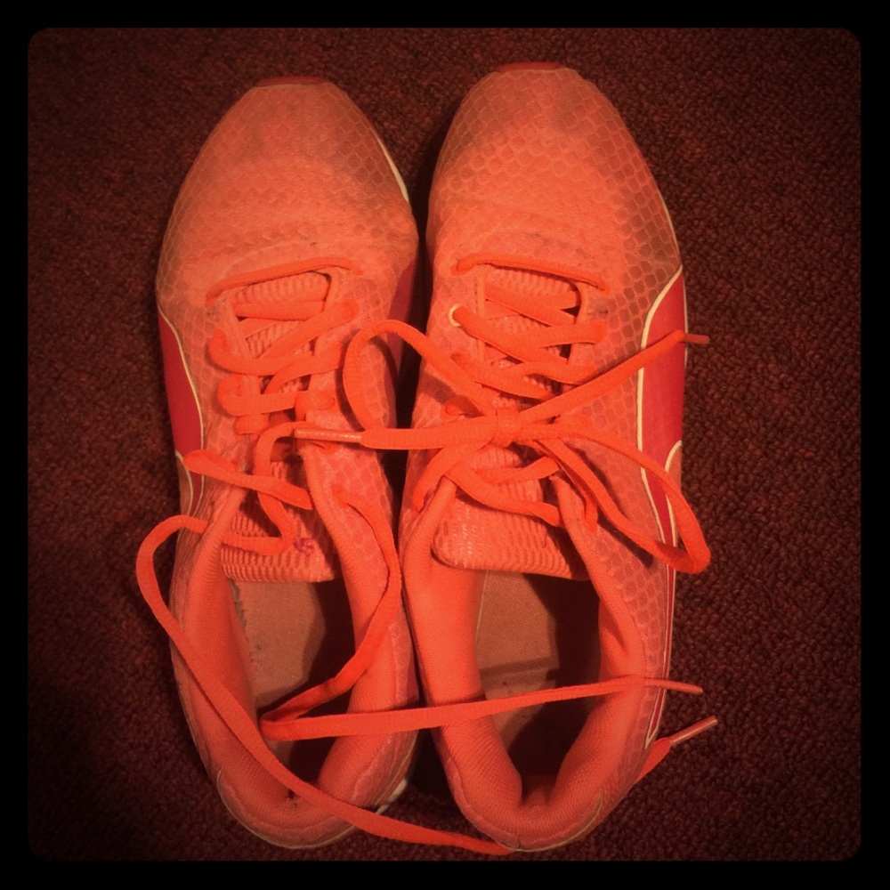neon orange and pink pumas in good condition
