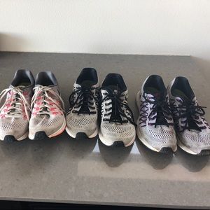 Three pair of Nike running shoes . All used.