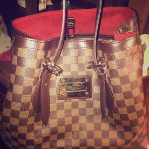 Louis Vuitton bag and wallet.