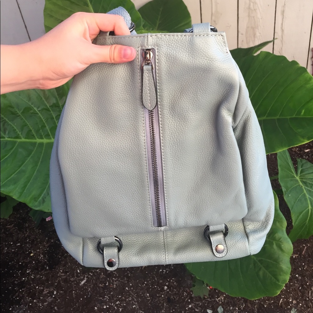 Blue backpack coverable into hand bag style